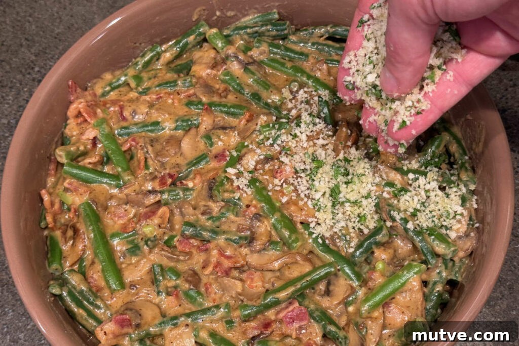 Topping green bean casserole with bread crumbs.