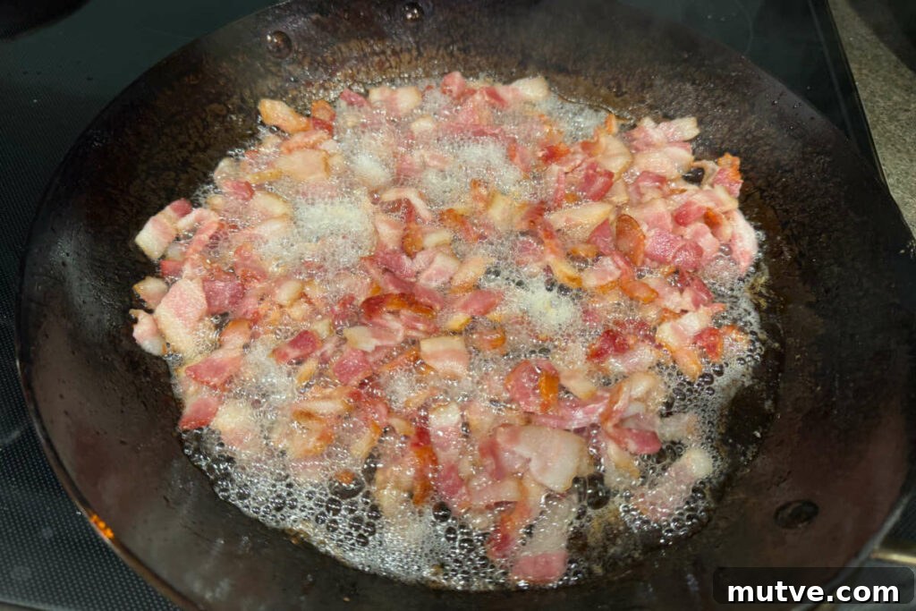 Cooking bacon in a fry pan.