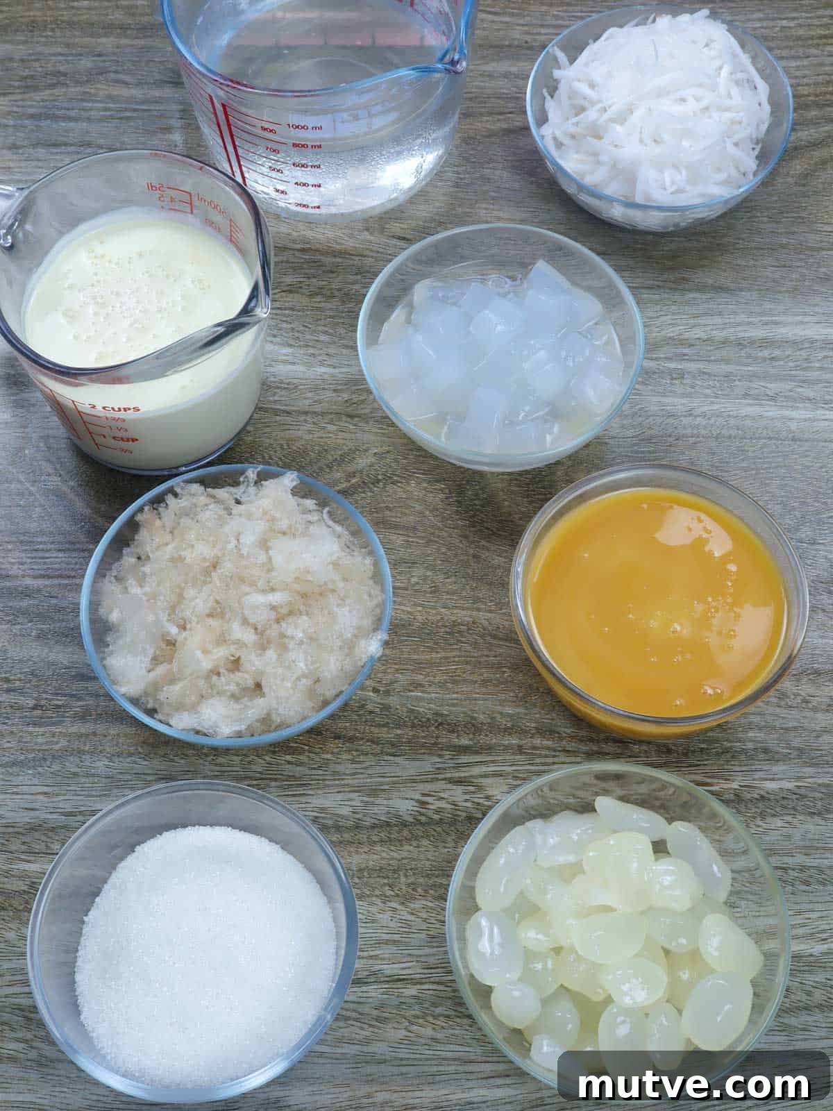 Creamy Buko Salad Recipe: Filipino Young Coconut Dessert 3 condensed milk, agar agar, kaong, nata de coco, shredded young coconut, Nestle cream in bowls