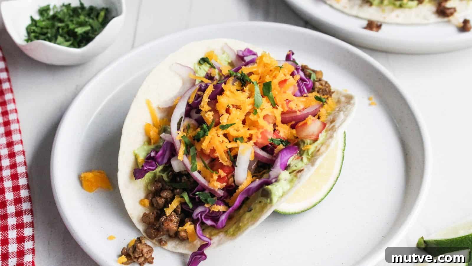 40 End-of-Summer Cookout Recipes to Celebrate Summer's Finale 14 An easy dish to look forward to cooking every night: a colorful taco with ground meat, shredded carrots, red cabbage, and a slice of lime on the side.