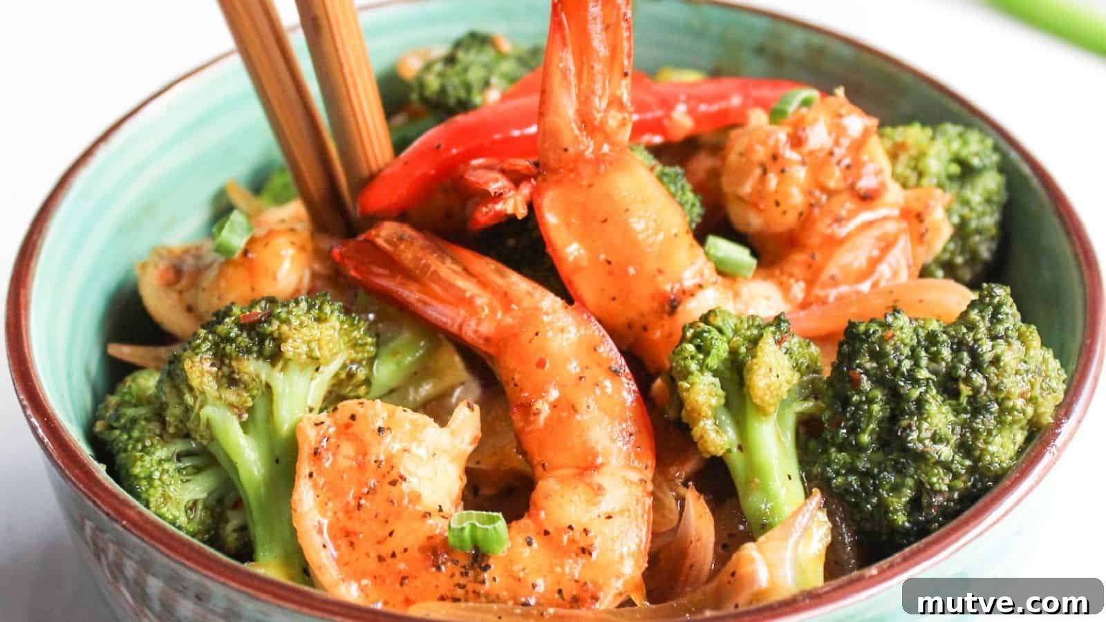 40 End-of-Summer Cookout Recipes to Celebrate Summer's Finale 18 Bowl of stir-fried shrimp and broccoli with chopsticks.