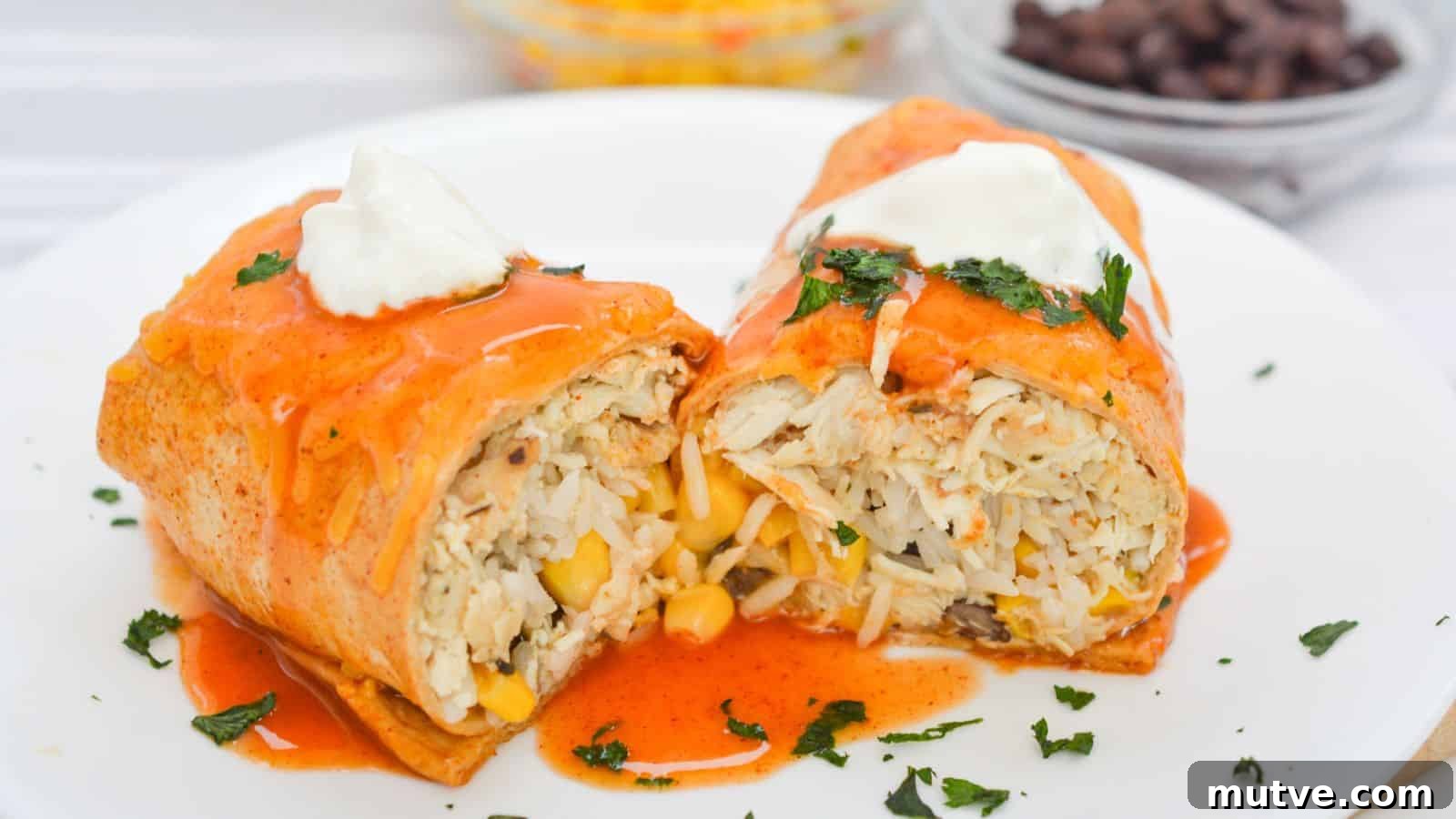 40 End-of-Summer Cookout Recipes to Celebrate Summer's Finale 20 Two chicken enchiladas topped with red sauce and sour cream, garnished with cilantro, served with a side of corn and black beans.