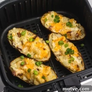 Air fryer twice baked potatoes after being cooked and still in the air fryer basket