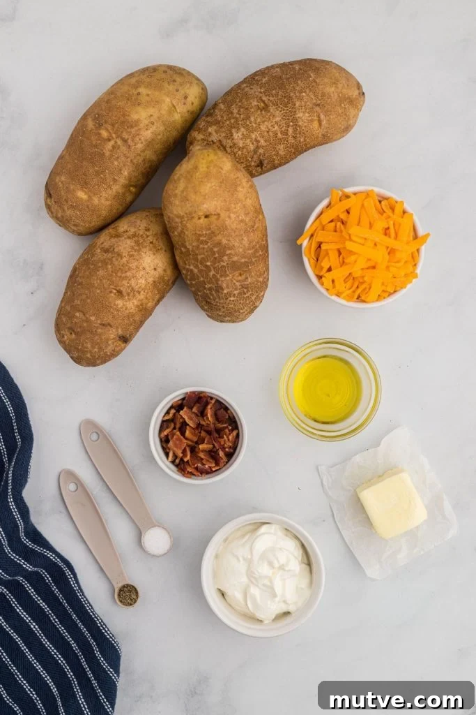 Ingredients needed to make potatoes stuffed with sour cream, cheese, and bacon.