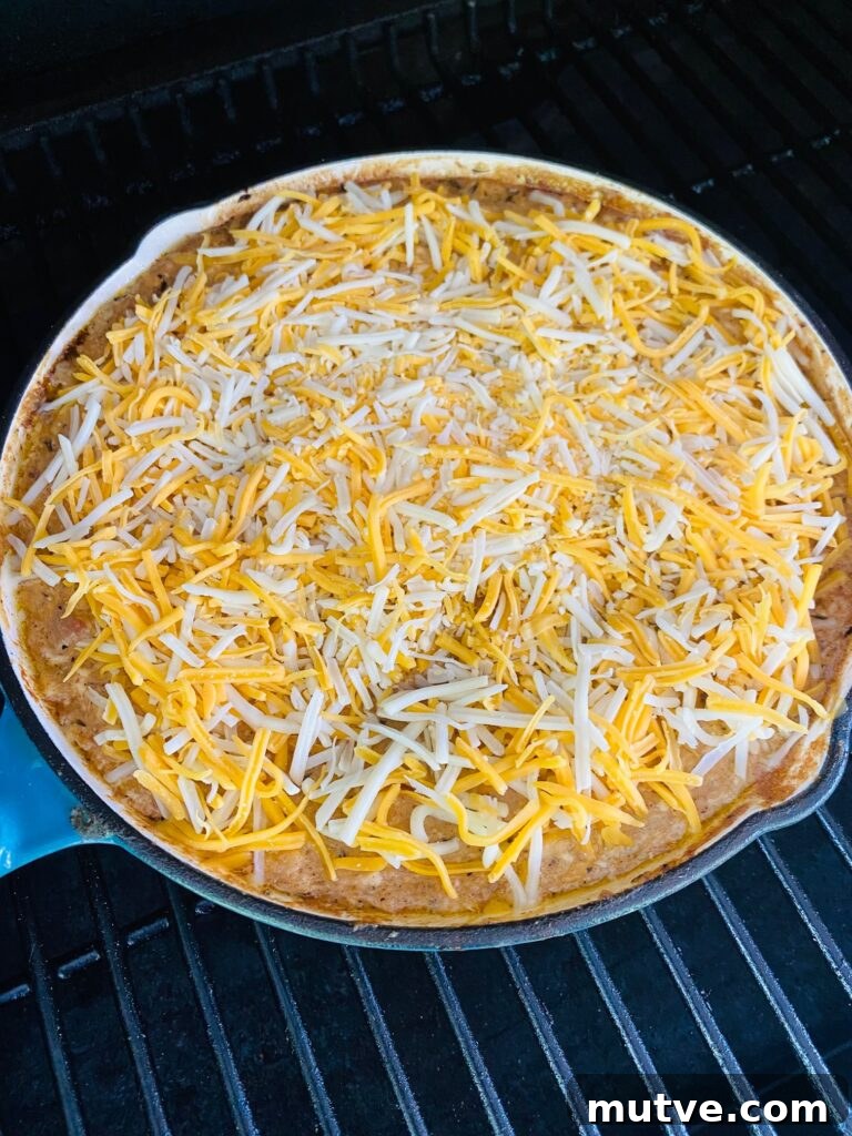 Spicy Caribbean Jerk Chicken Dip Recipe 5 dip topped with cheese before melting