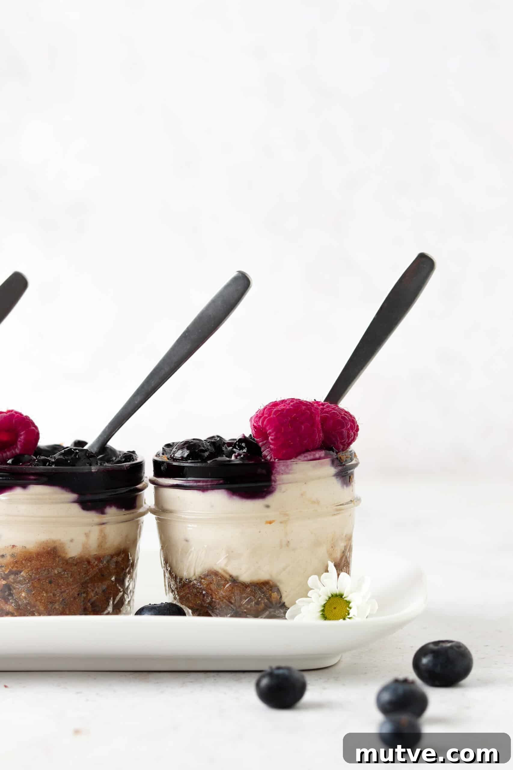 Close up picture of vegan blueberry cheesecake cups.
