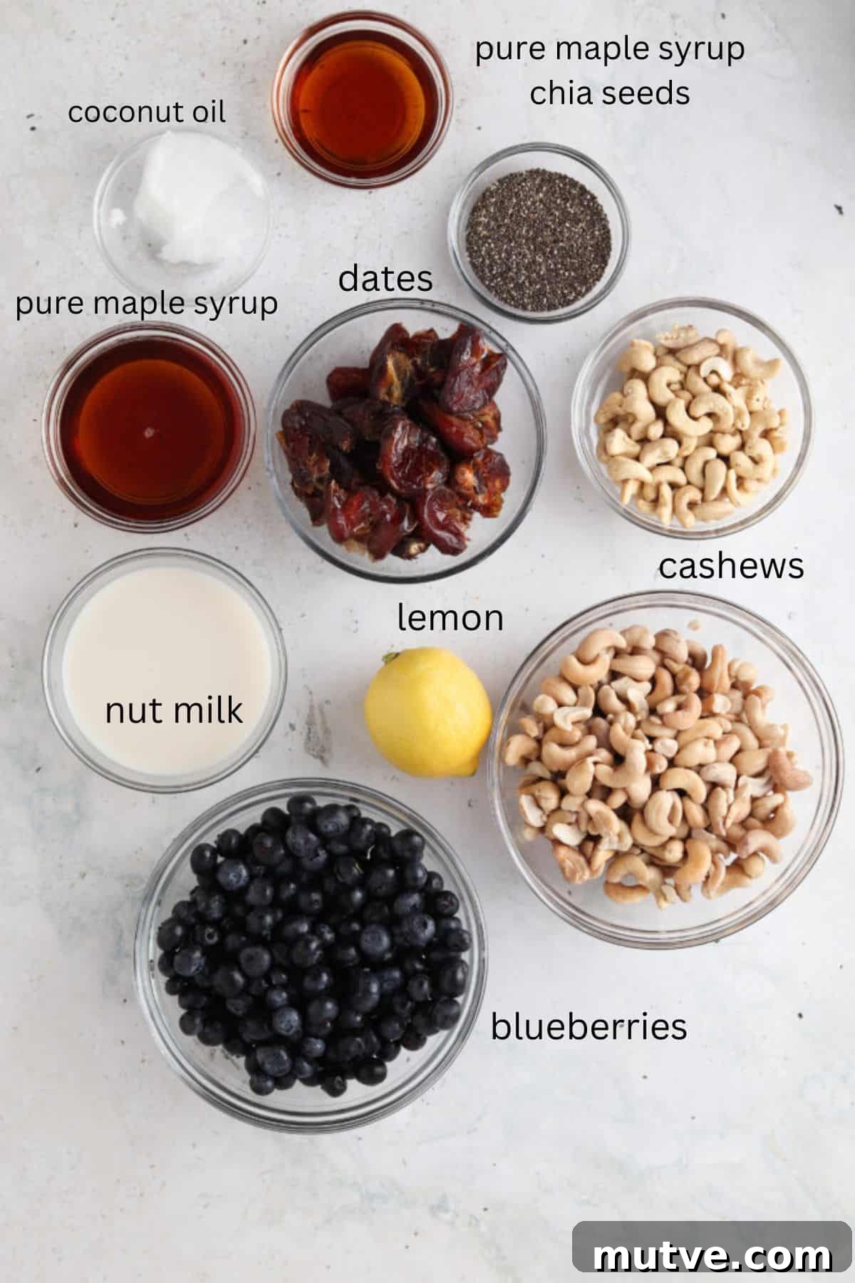 Vegan blueberry cheesecake ingredients in small glass bowls.