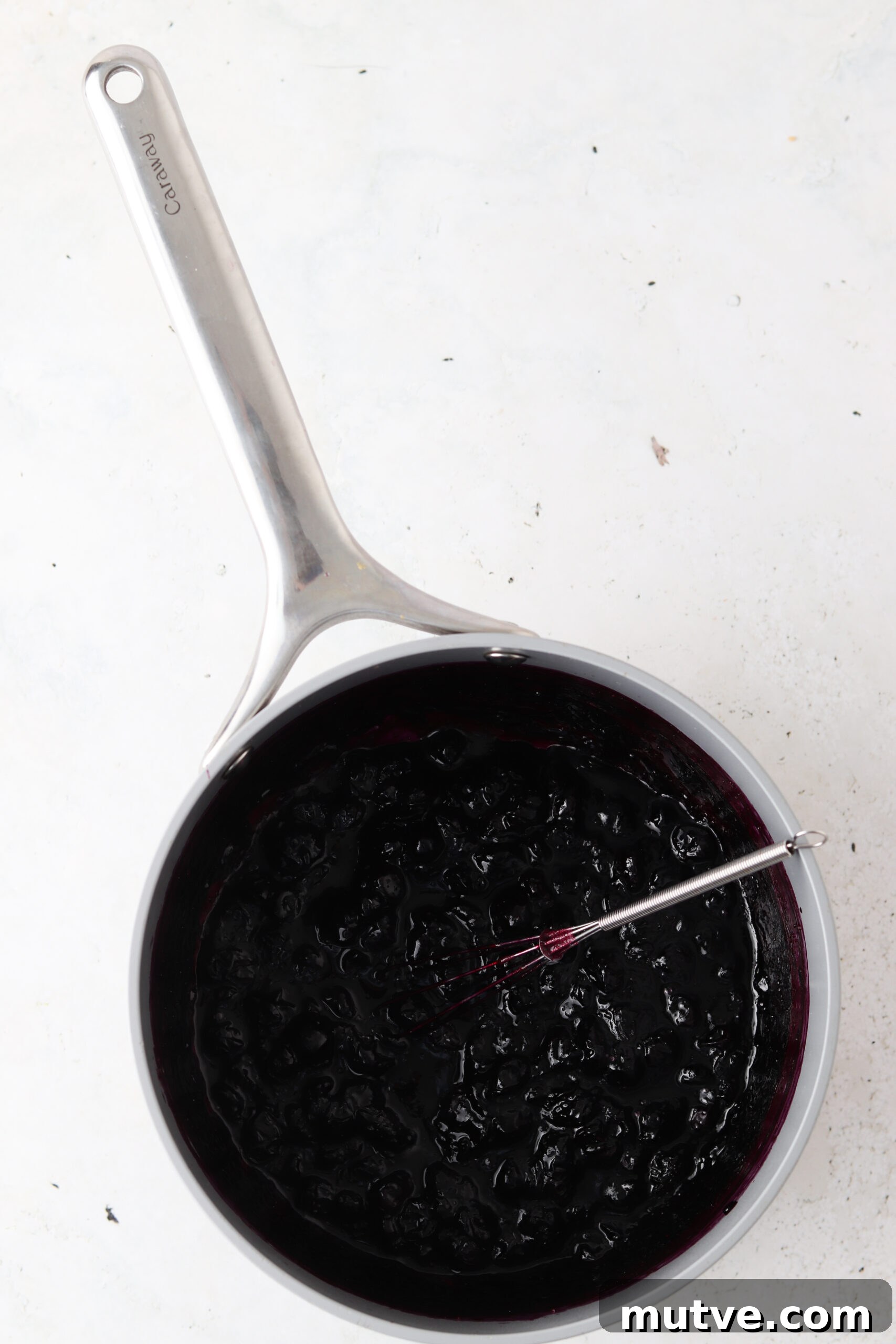 Blueberry maple jam ingredients in a saucepan.