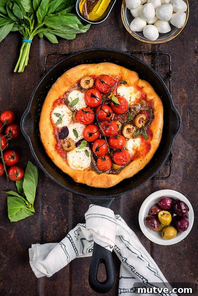 Puttanesca skillet pizza with olives, anchovies and mozzarella