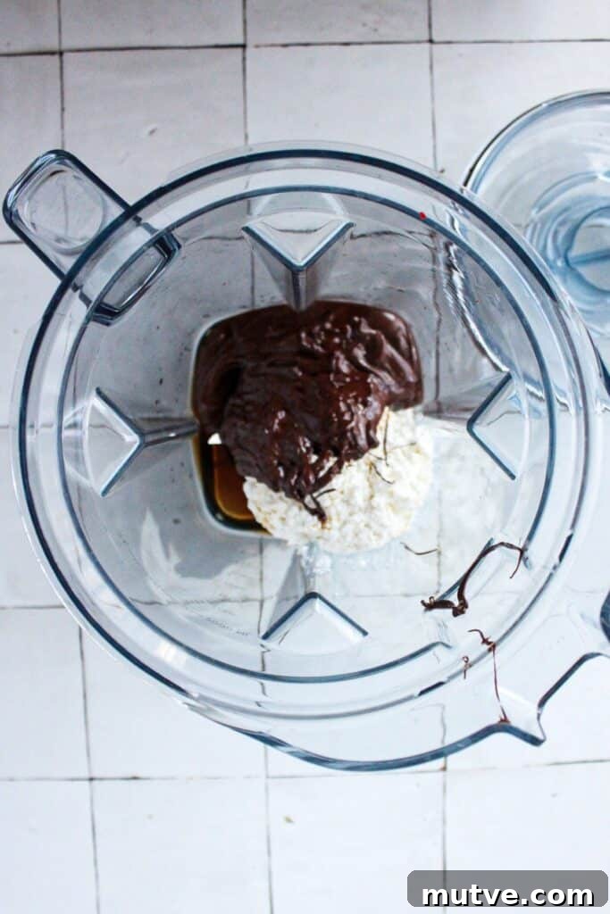 High-Protein Cottage Cheese Fudge - 4-Ingredient Recipe 4 Cottage cheese, maple syrup, vanilla and melted chocolate chips in a blender.