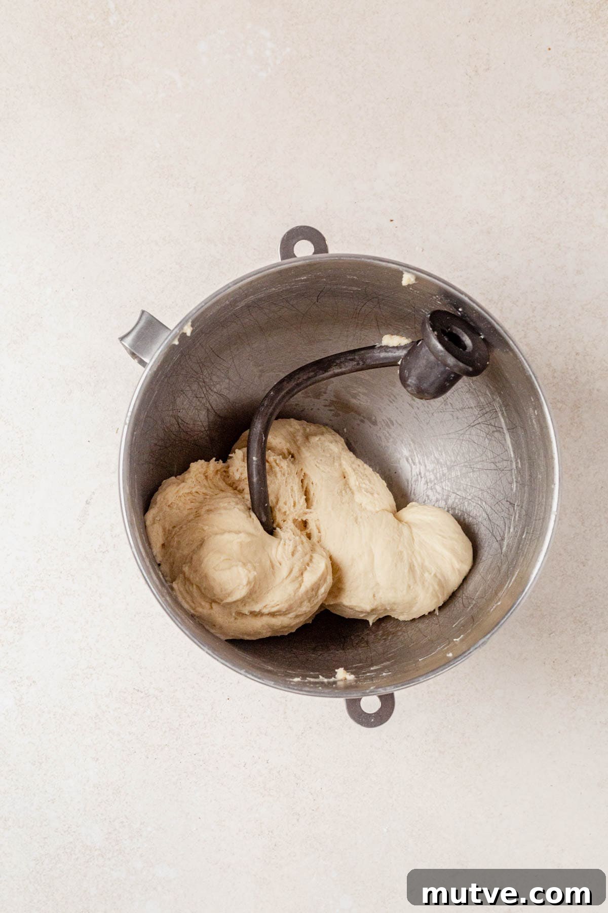 kneading cottage cheese dinner roll dough in a stand mixer.