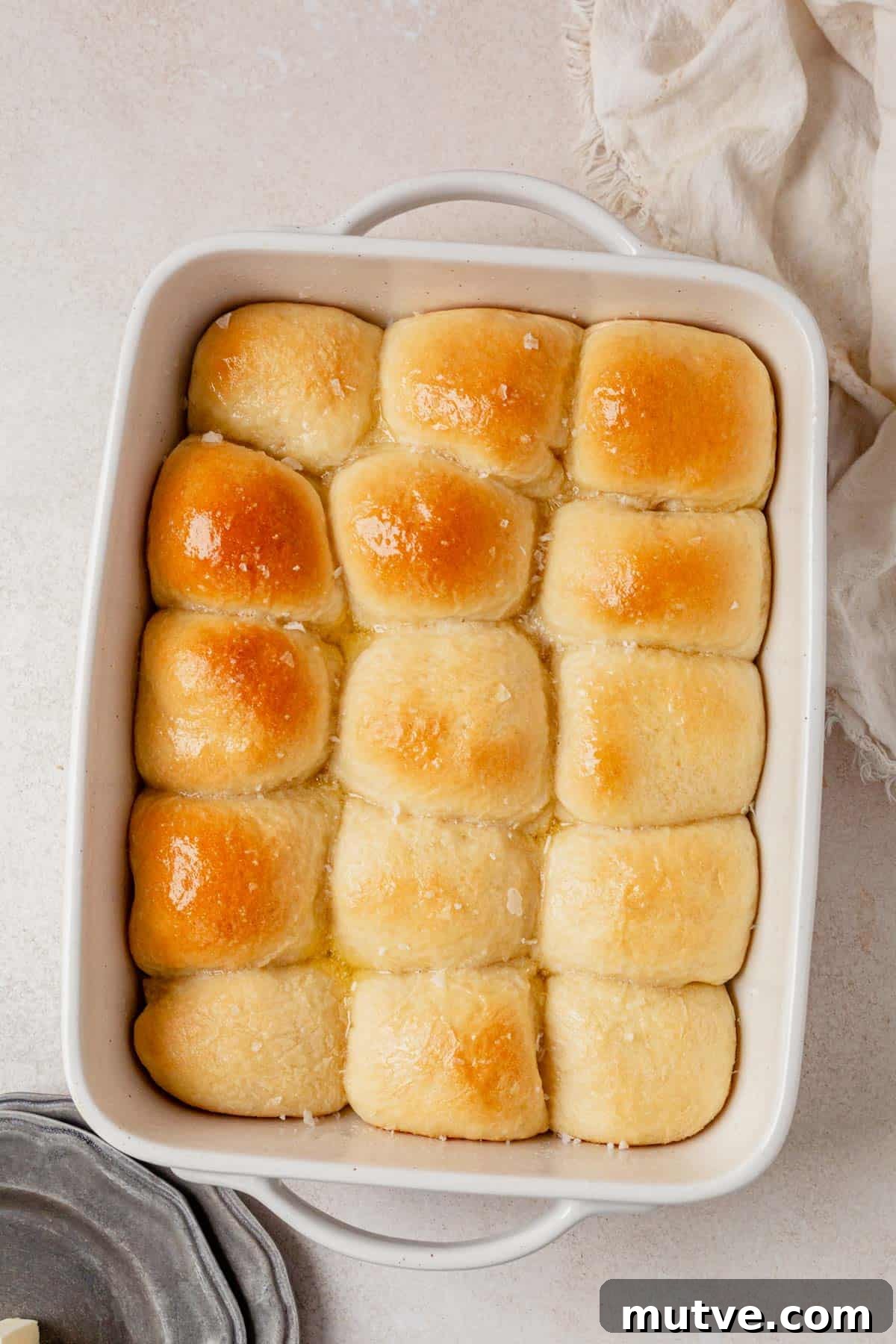 fresh baked cottage cheese dinner rolls cooling in a pan.
