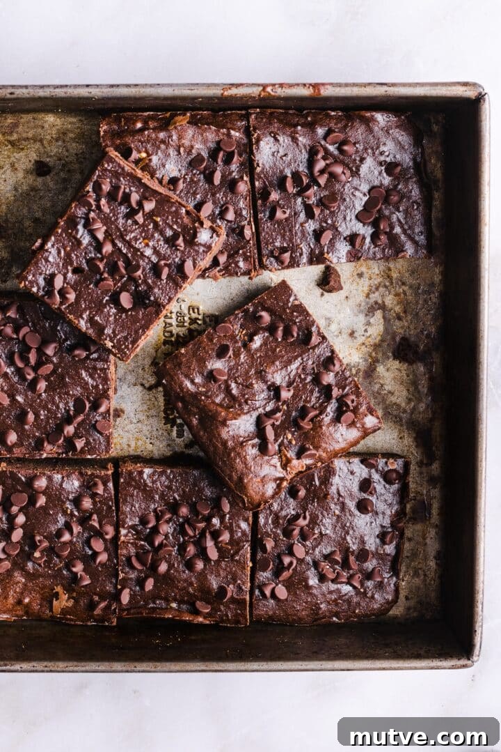 Cottage Cheese Brownies Recipe: Moist, Protein-Packed Treat 2 A tray of baked cottage cheese brownies, sliced into squares