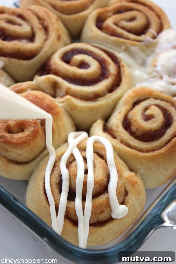Easy Apple Cinnamon Rolls with Cream Cheese Icing- Since we use store bought crescent sheets, they come together quite quickly. Perfect fall breakfast or dessert.