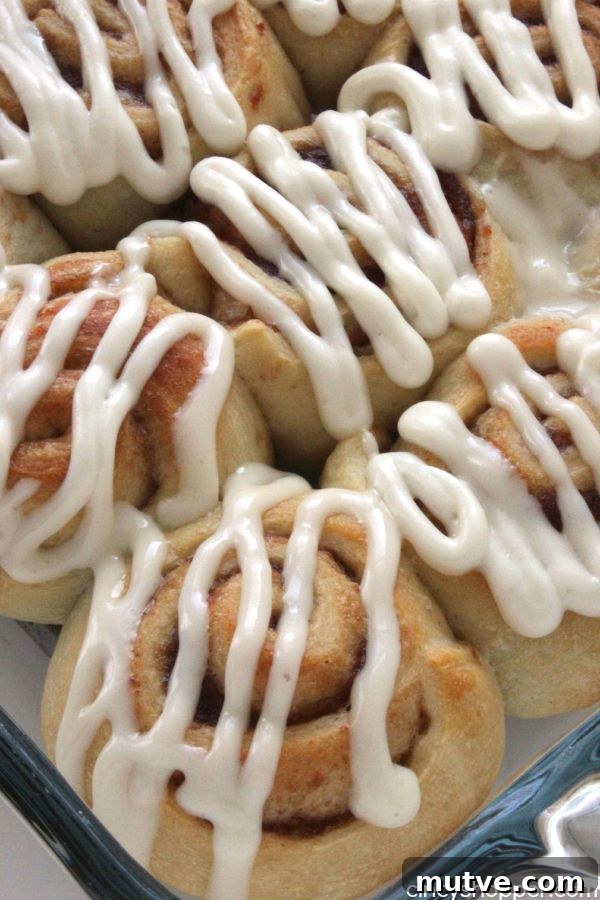 Easy Apple Cinnamon Rolls with Cream Cheese Icing- Since we use store bought crescent sheets, they come together quite quickly. Perfect fall breakfast or dessert.
