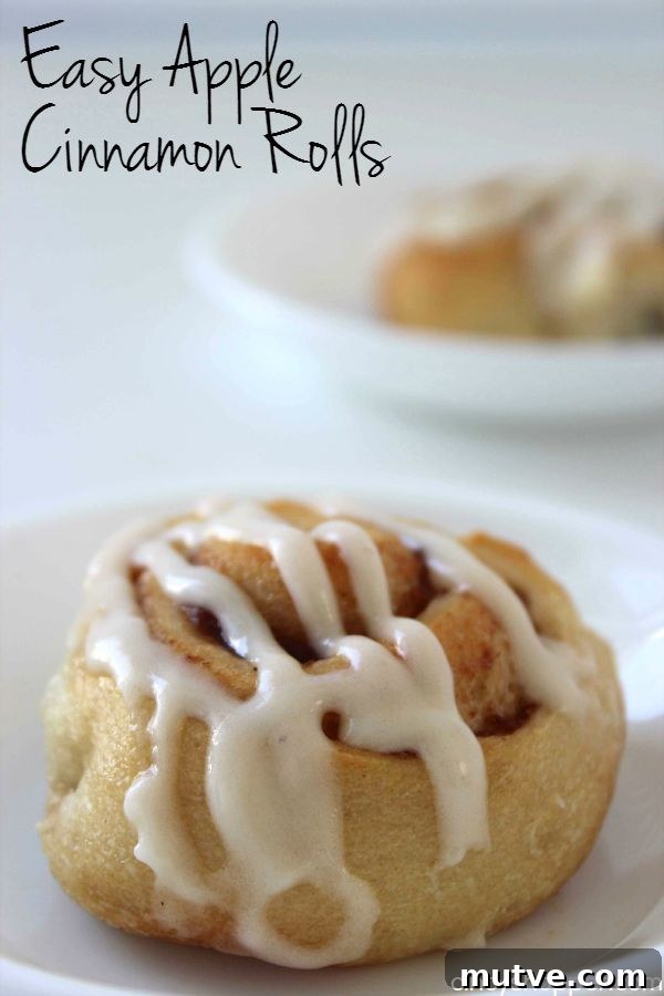 Easy Apple Cinnamon Rolls with Cream Cheese Icing- Since we use store bought crescent sheets, they come together quite quickly. Perfect fall breakfast or dessert.