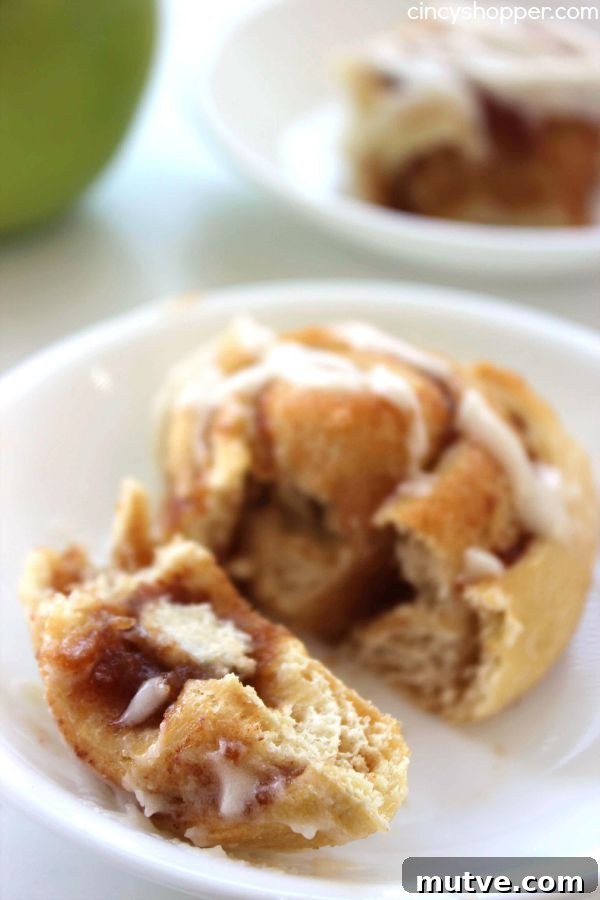 Easy Apple Cinnamon Rolls with Cream Cheese Icing- Since we use store bought crescent sheets, they come together quite quickly. Perfect fall breakfast or dessert.