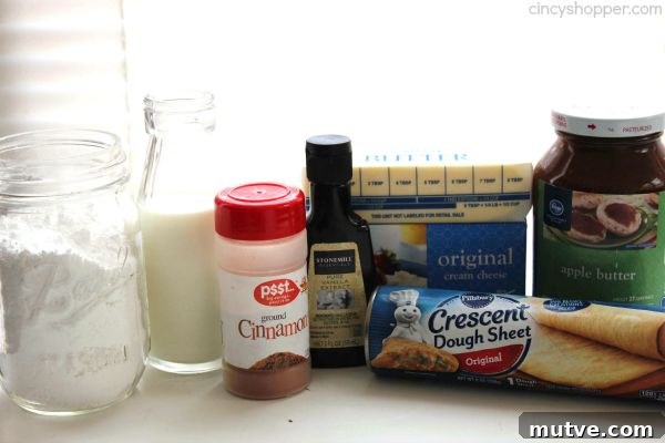 Easy Apple Cinnamon Rolls with Cream Cheese Icing- Since we use store bought crescent sheets, they come together quite quickly. Perfect fall breakfast or dessert.