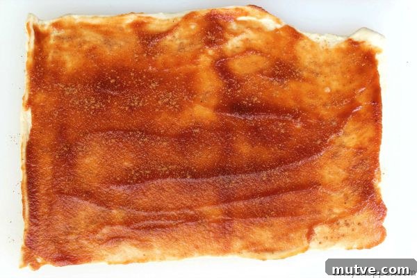 Easy Apple Cinnamon Rolls with Cream Cheese Icing- Since we use store bought crescent sheets, they come together quite quickly. Perfect fall breakfast or dessert.