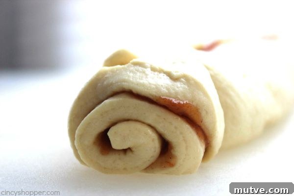Easy Apple Cinnamon Rolls with Cream Cheese Icing- Since we use store bought crescent sheets, they come together quite quickly. Perfect fall breakfast or dessert.