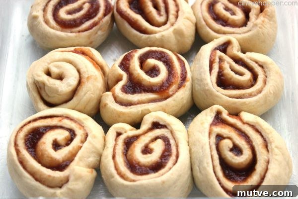 Easy Apple Cinnamon Rolls with Cream Cheese Icing- Since we use store bought crescent sheets, they come together quite quickly. Perfect fall breakfast or dessert.