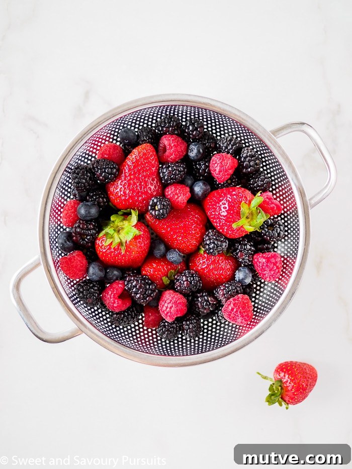 Fluffy Whole Wheat and Quinoa Flour Pancakes 3 Bowl of mixed berries - strawberries, blueberrie, raspberries and blackberries.