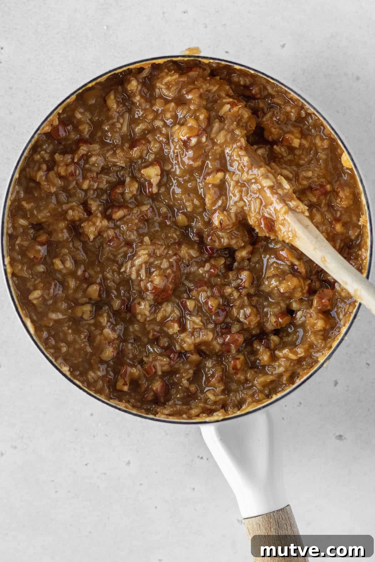 Dairy-free German chocolate cake frosting in a saucepan.