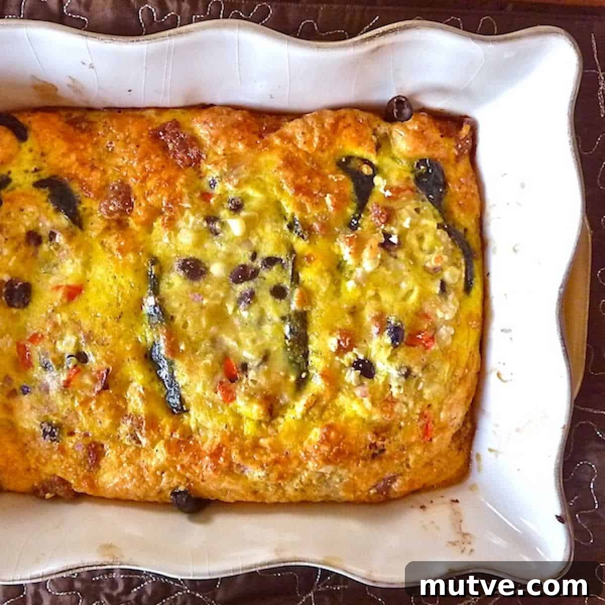 Egg Bake Chile Rellenos Chile rellenos casserole with eggs fresh from the oven in a baking dish.