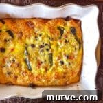 Baked Chiles Rellenos Casserole with Eggs 2 Chile rellenos casserole with eggs fresh from the oven in a baking dish.
