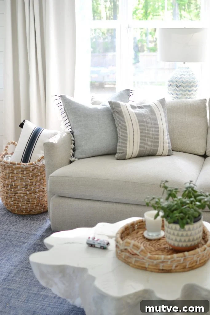 throw pillows on a grey couch in a living room