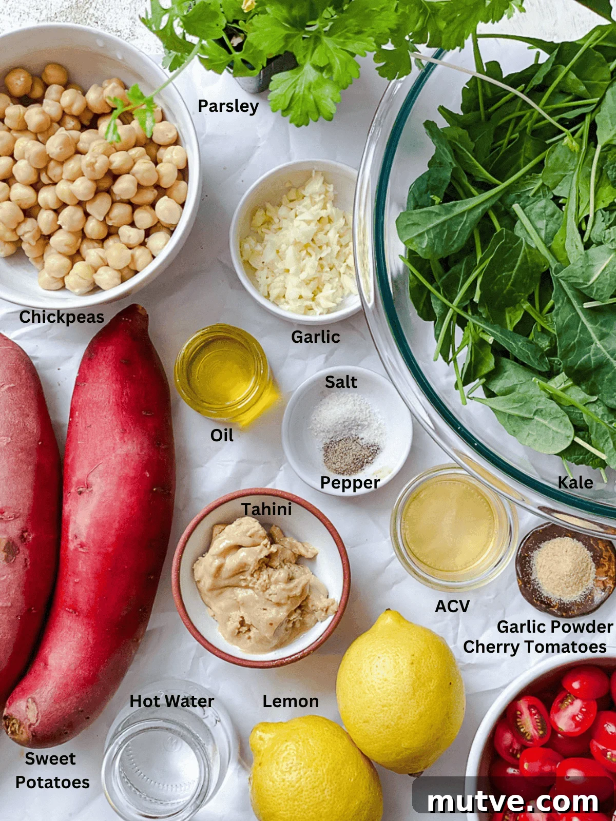 ingredients for Sweet Potato and Kale Salad measured out on a white surface