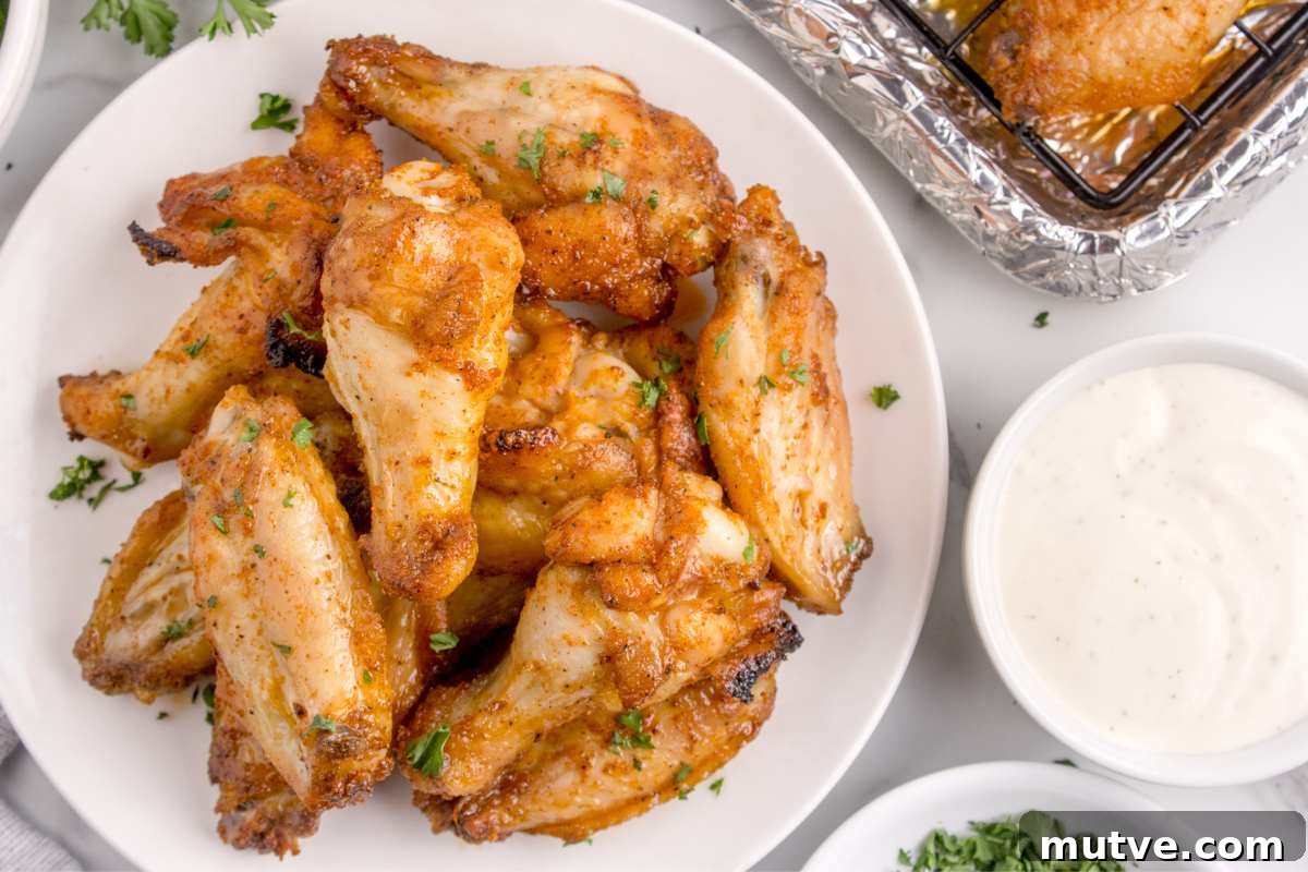 Extra Crispy Oven-Baked Chicken Wings Recipe 9 overhead of plate of baked chicken wings.
