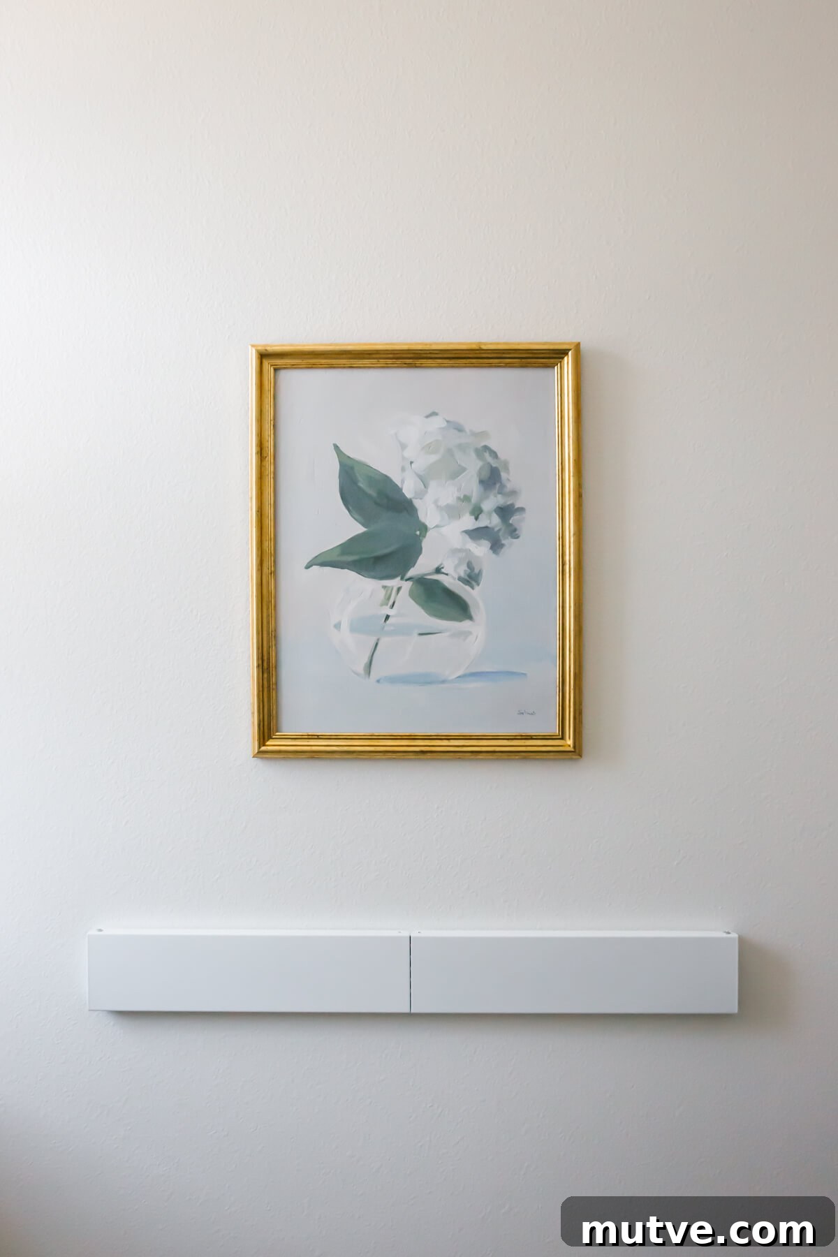 Laundry room artwork and wall drying rack.