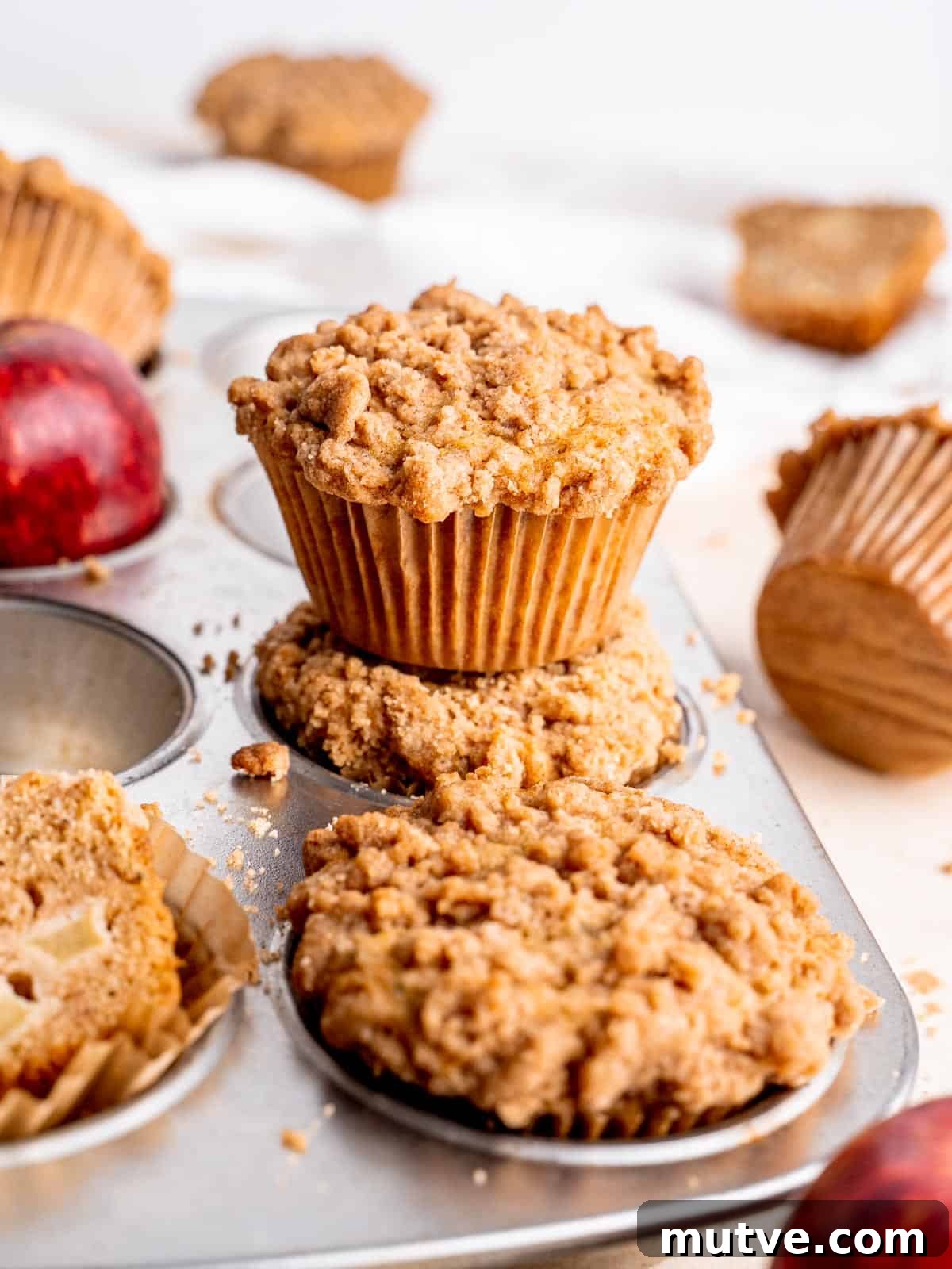 Apple Streusel Muffins Recipe with Cinnamon Crumble 6 apple streusel muffins in a muffin tin