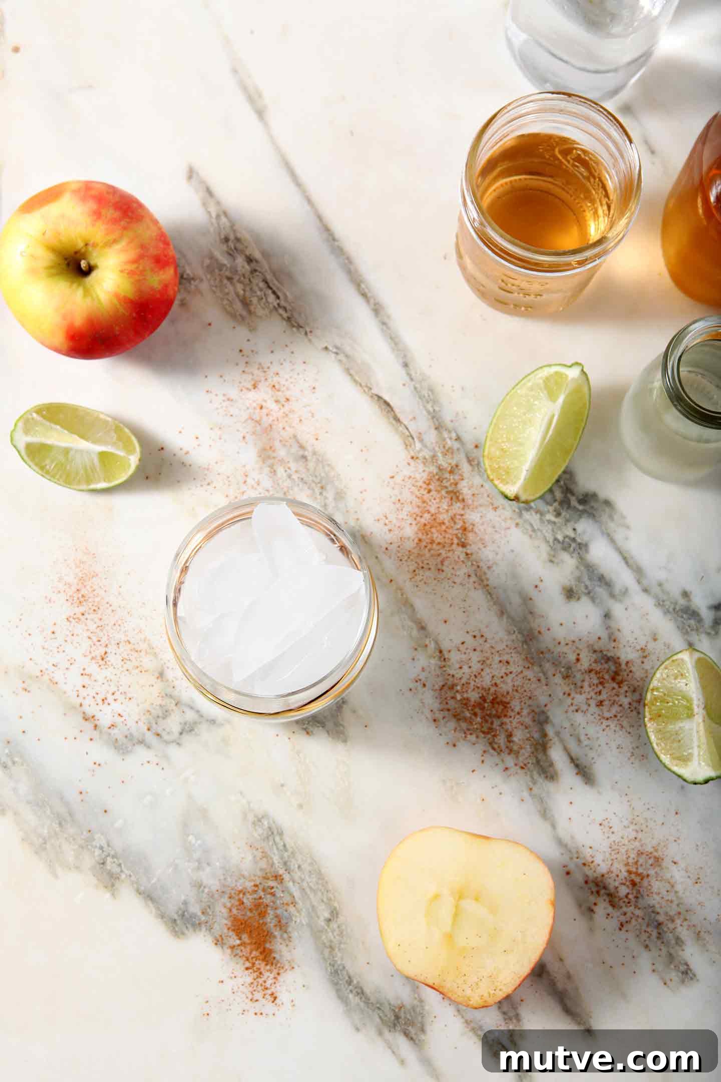 Apple Cider Moscow Mule Cocktail Recipe 3 Ingredients for a cider Moscow Mule lined up on marble