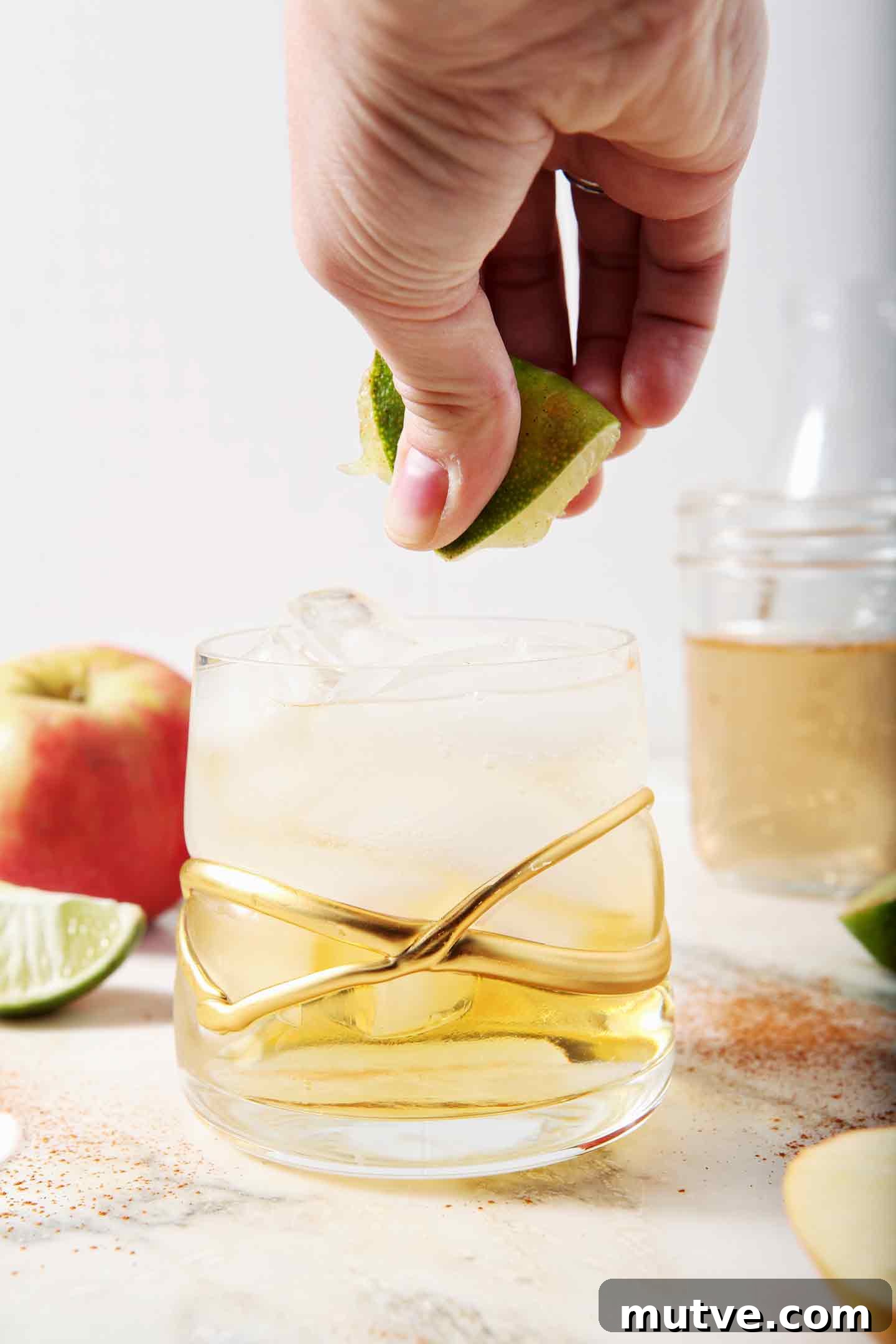 Apple Cider Moscow Mule Cocktail Recipe 7 A lime is squeezed into a newly mixed Apple Cider Mule
