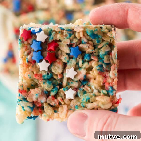 Browned Butter Rice Krispie Treats 16 closeup of a hand holding a patriotic rice crispy treat