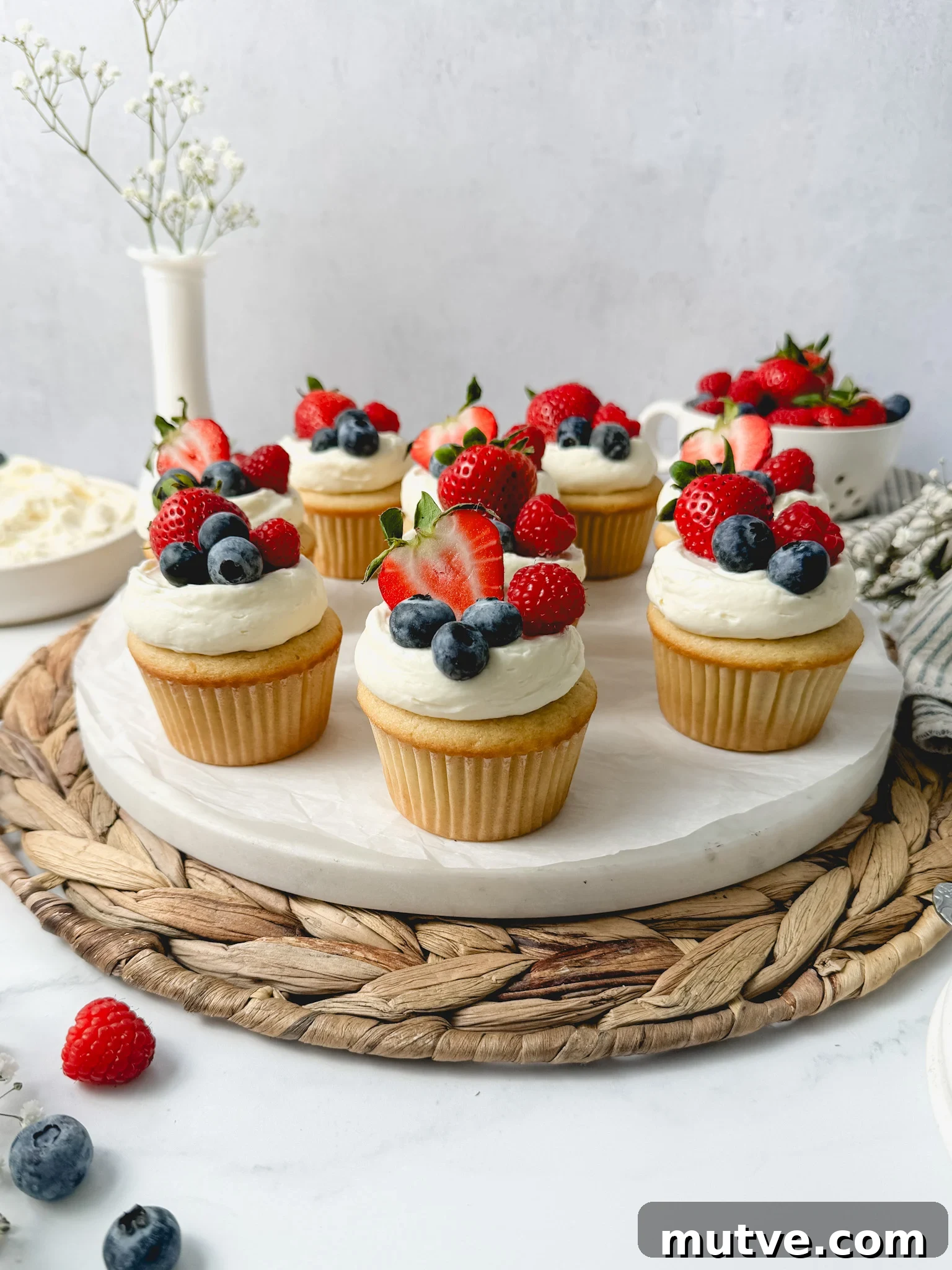 Cupcakes topped with berries