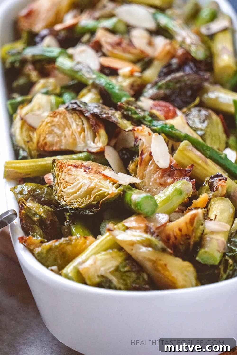 Crispy Brussels sprouts recipe roasted in the oven that yield wonderful toasty flavored Brussels sprouts combined with asparagus finished with a sweet Dijon mustard sauce. A simple healthy crispy Brussels sprouts recipe perfect as a special meal or side dish for Christmas dinner. Fresh or frozen Brussels sprouts they both will work!