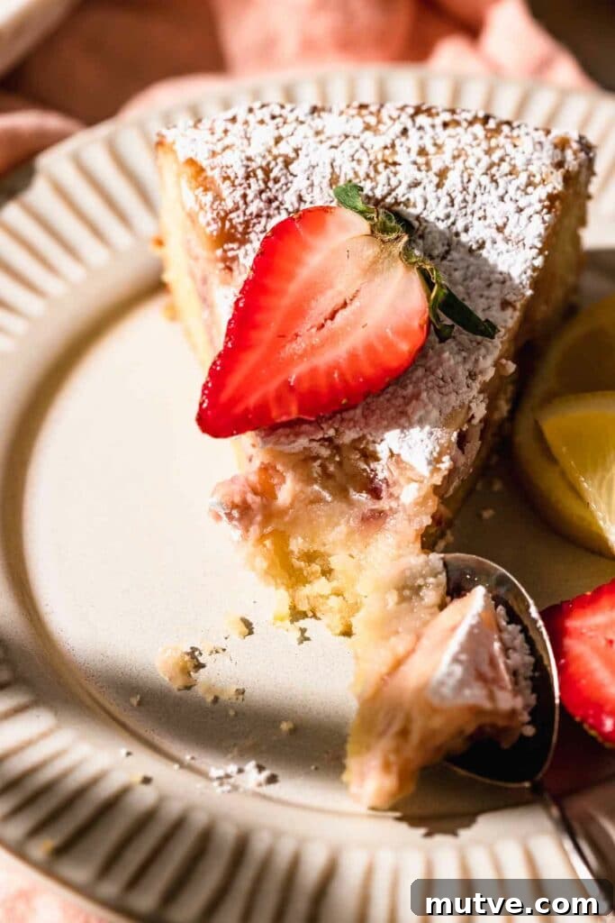strawberry butter cake slice with strawberry on top