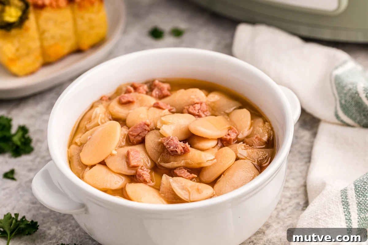 slow cooker lima beans in a white bowl.