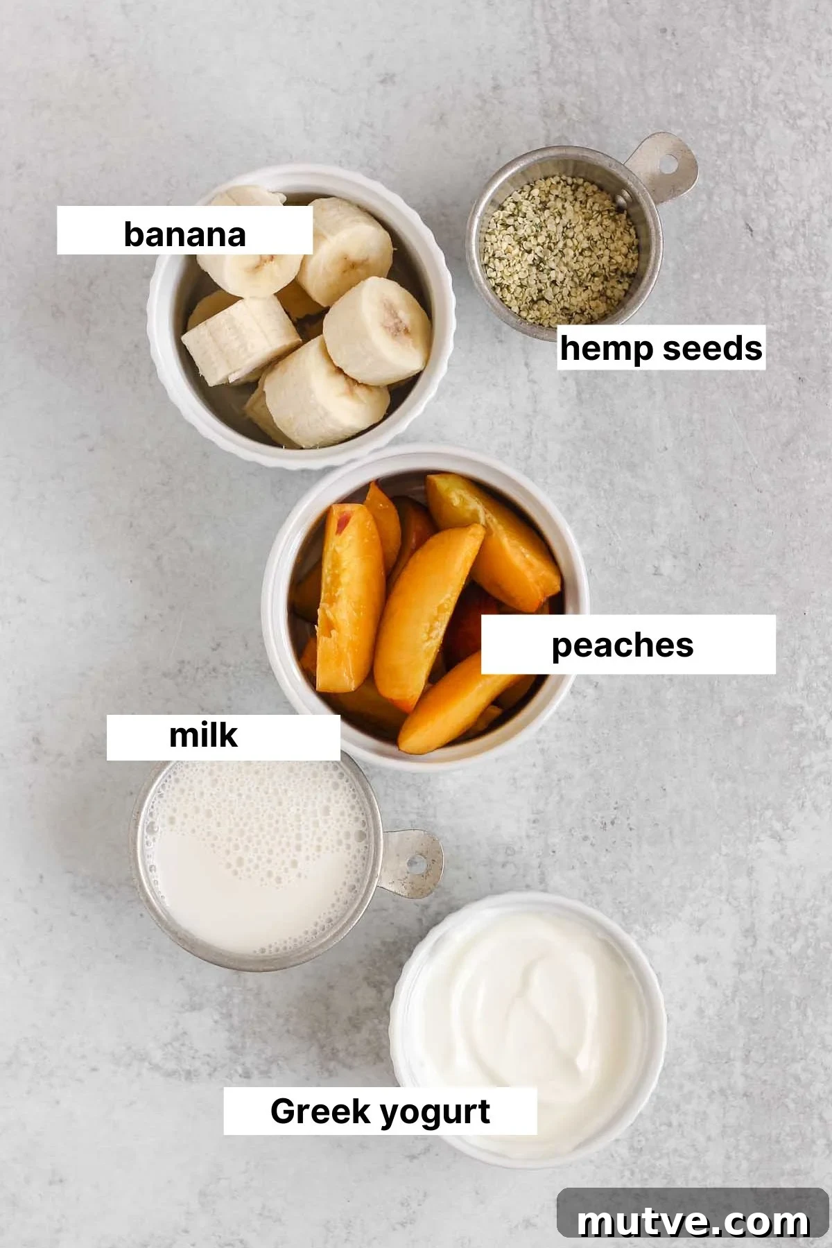 Labeled ingredients for a peach banana smoothie.