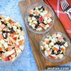 Overhead view of three bowls of Apple Raisin Salad