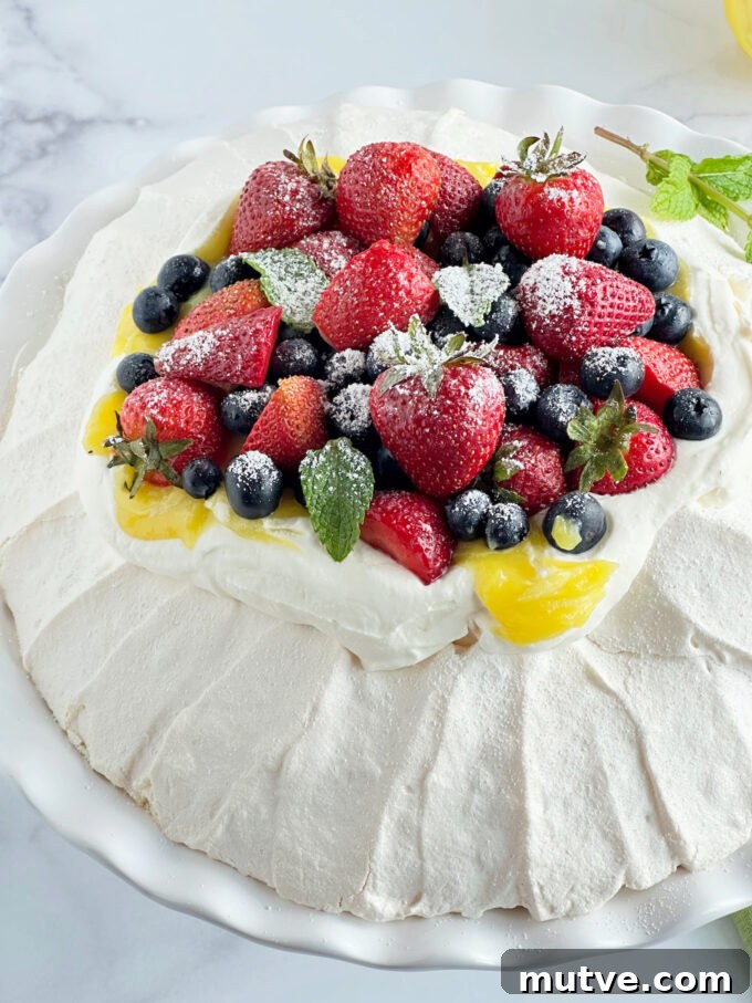 Zesty Lemon Curd and Berry Pavlova 5 Lemon Curd and Berry Pavlova.